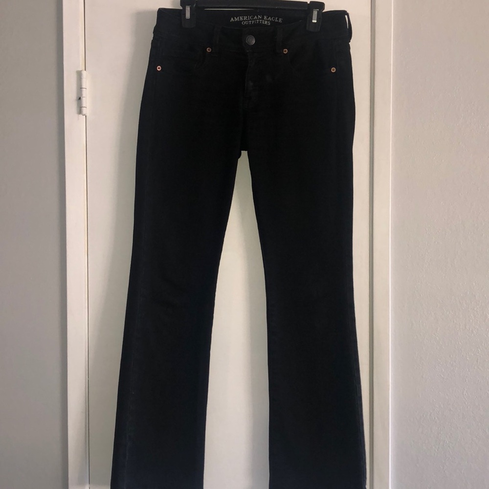 Black American Eagle “Kick Boot” jeans.